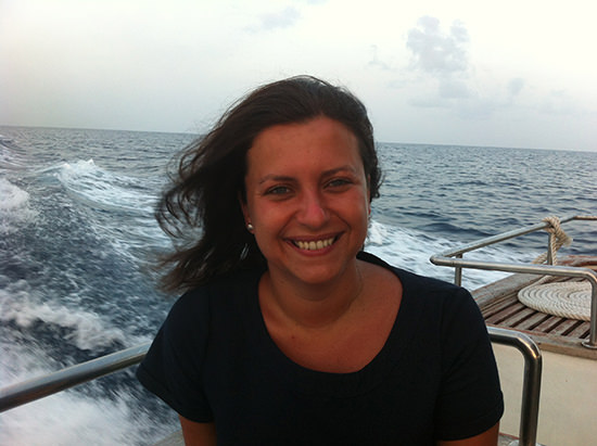 Navy dress, a tan and a smile. Sunset happiness at Iru Fushi