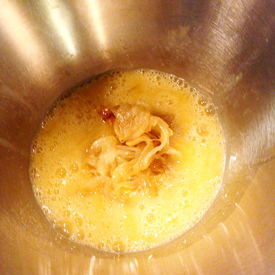 Add the onion and salt to the eggs