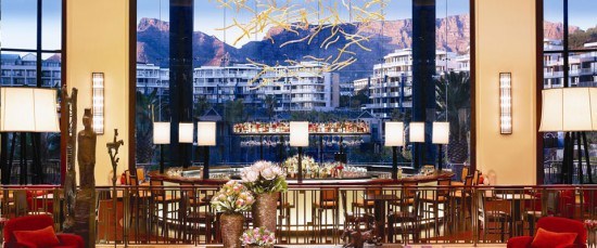 The stunning lobby area featuring the bar and stunning views of Table Mountain. Photo by hotel.