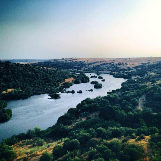 The Guadiana river which, further south, separates Portugal from Spain (when it reaches the Algarve)